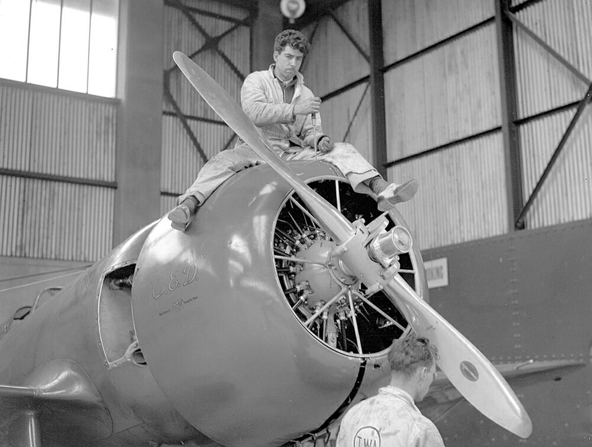  Mechanic working on Granville Bee Gee R-6H flown by American aviatrix Jacqueline Cochran (did not finish) 