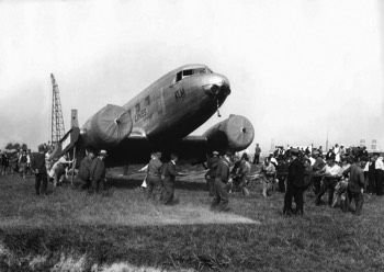  DC-2 (PH-AJU) being hauled from the Waalhaven docks (Rotterdam) to the nearby airport for reassembly by the Fokker company 