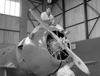  Mechanic working on Granville Bee Gee R-6H flown by American aviatrix Jacqueline Cochran (did not finish) 