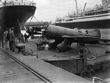  Lambert Monocoupe D-145 (NR501W) 'Baby-Ruth' and Jacqueline Cochran's Granville Gee Bee R-6H 'Q.E.D' being unloaded at Southampton 