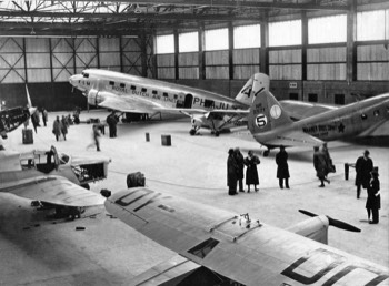  Competitor aircraft in the hangar at Mildenhall, Uiver in background 